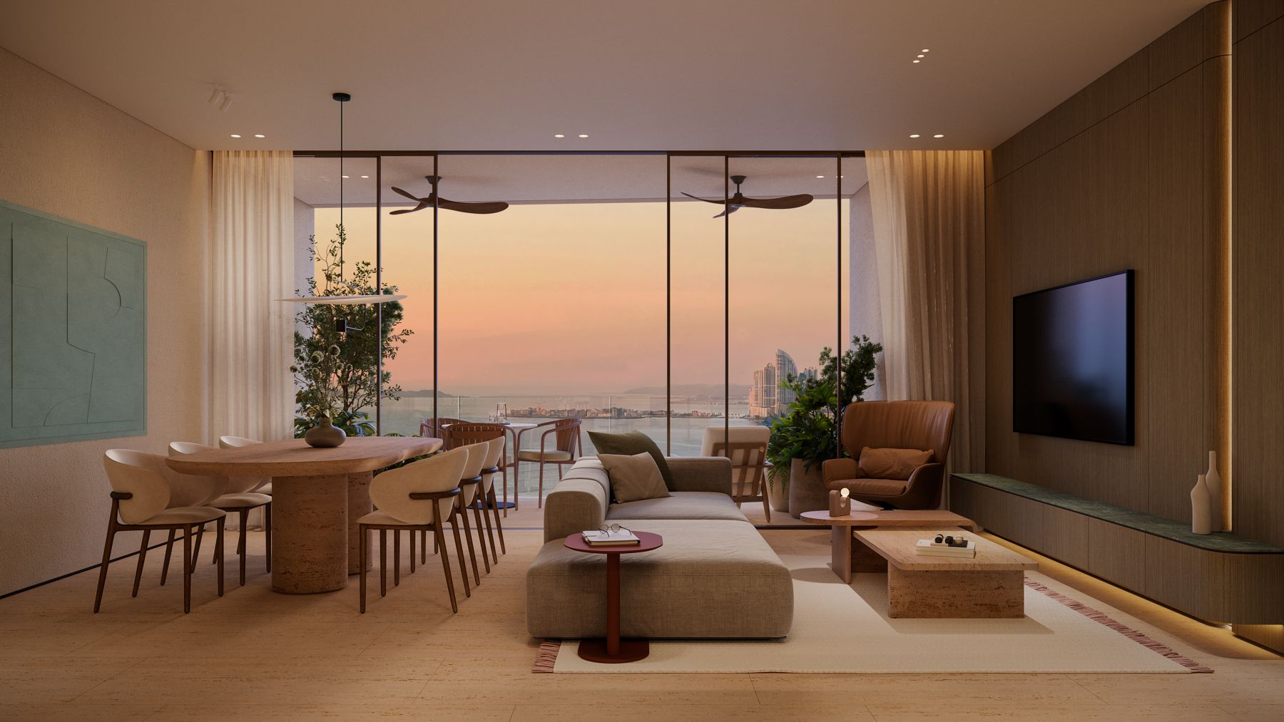 Sala y comedor con vista al mar y a la ciudad al atardecer