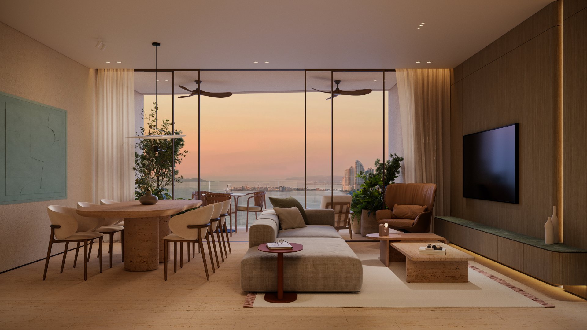 Sala de una residencia Sensa con ventanales hacia el mar al atardecer